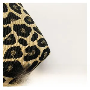 Close-up of premium leopard print jacquard fabric with detailed woven texture on bag