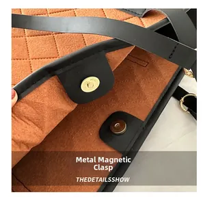 Detailed view of the brown quilted felt tote bag featuring a gold magnetic snap button