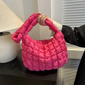 Pink quilted cloud hobo bag with puffy pleated texture and minimalist shoulder design