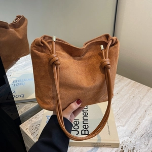 Brown matte leather tote bag with knotted handles and Fashion and Sunday print