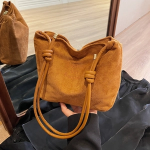 Brown faux suede tote bag with knotted strap and Fashion and Sunday embossed text