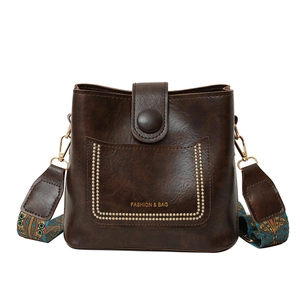 Retro dark brown bucket bag with wide bohemian strap and golden rivet accents