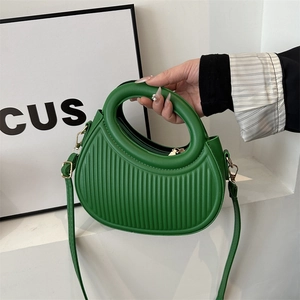 Fashionable bright green pleated crescent handbag with adjustable shoulder strap and round handle