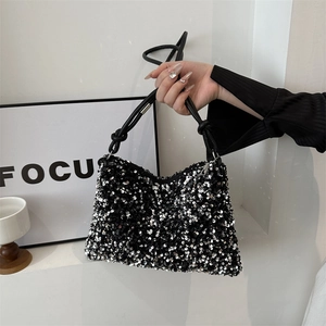 Trendy black and silver sequin shoulder bag with knot strap for 2024 spring fashion