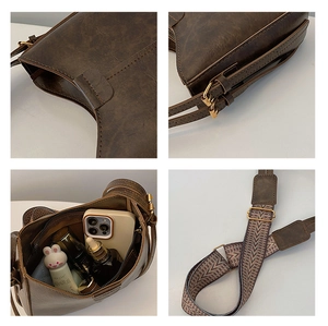 Détails du sac vintage en cuir marron foncé avec bandoulière large tissée et finitions