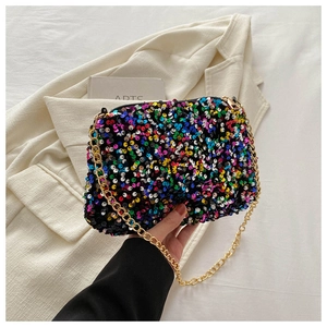 Detail showing colorful sequins and gold chain strap of a stylish square crossbody bag