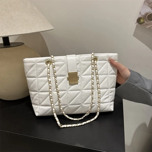 Chic white quilted tote bag with gold chain strap and metallic lock for daily use