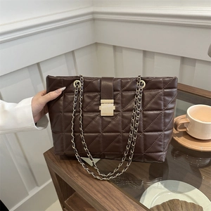 Chic dark brown quilted tote bag with golden chain straps and lock for daily commute