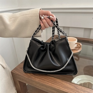 Chic black lychee leather handbag with cloud pleats and chain handles for women