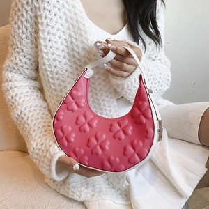 Pink crescent moon handbag with embossed clover patterns and white top handle for women