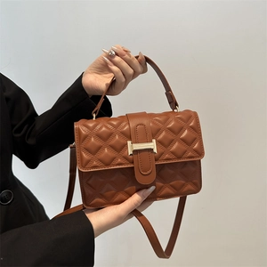 Brown quilted crossbody bag with diamond pattern and gold metal buckle for women