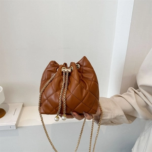 Brown quilted leather bucket bag with gold chain strap and pearl drawstring detail