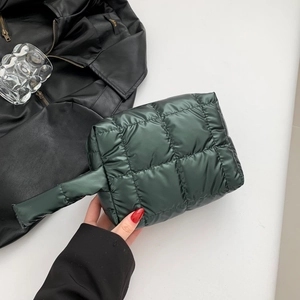 Dark green quilted padded handbag with glossy finish and top handle for women