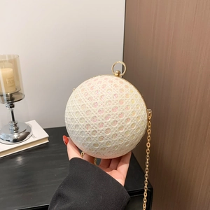 Spherical white sequin evening bag with gold ring handle and diamond mesh pattern