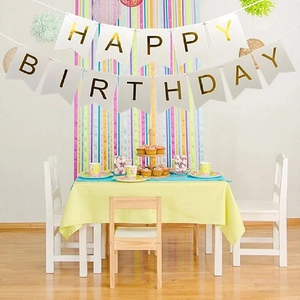 Detail of white swallowtail cards with gold foil Happy Birthday letters for party decor