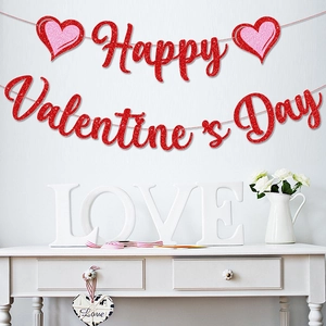 Red glitter Happy Valentine's Day banner with heart elements on a gray wall