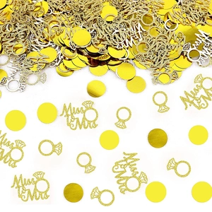 Glittery gold confetti set with Miss to Mrs, diamond rings and round shapes for party decor