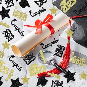 Black and gold graduation table confetti with grad caps, stars, and congrats grad text