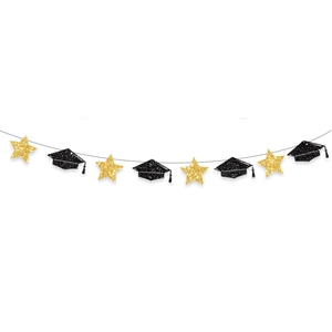 Detail of glitter gold stars and black graduation cap banner for party wall decor