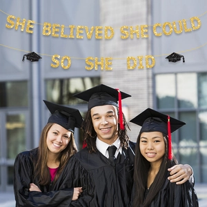 Golden glitter graduation banner with inspirational quote shown over students celebrating