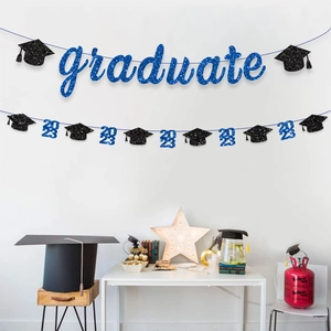 2026 Graduation party banner with blue glitter letters and black doctoral cap decor