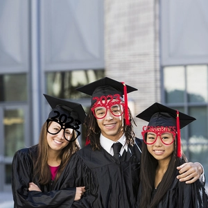 Students wearing 2023 graduation party paper glasses with red and black glitter accents