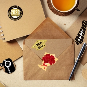 Class of 2023 graduation stickers on craft envelopes and notebooks for gift decoration