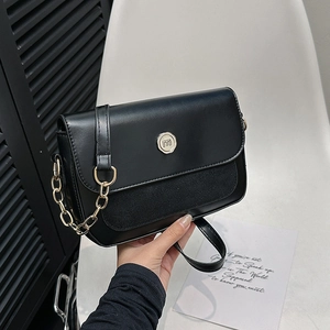 Retro black leather crossbody bag with gold metal clasp and chain strap for women