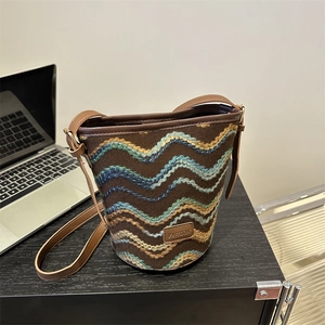 Brown knit bucket bag with blue waves and leather strap for women's daily casual use