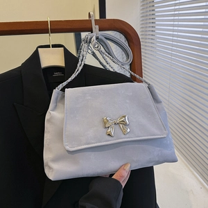 Chic light gray suede shoulder bag with silver metal bow and chain strap for women