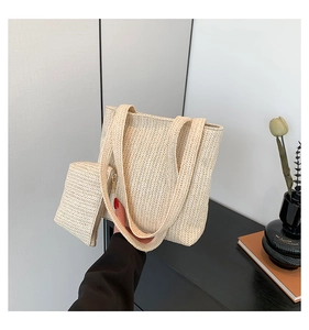 Detail of woven tote bag with herringbone pattern and matching zippered pouch