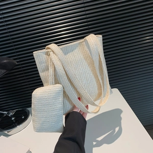 Minimalist beige woven straw tote bag set with matching inner pouch for summer beach travel