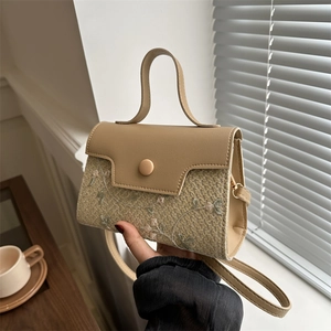 Elegant beige straw woven crossbody bag with floral embroidery and PU leather flap detail