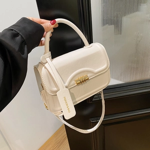 Minimalist cream white crossbody handbag with gold hardware and top handle for women