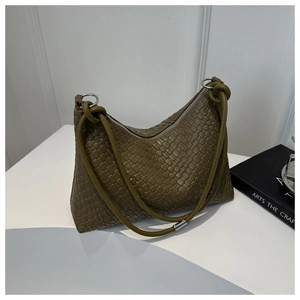 Close-up of olive green woven leather Hobo bag with knot detail and silver metal ring
