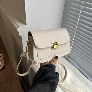 Elegant off-white rectangular crossbody bag with golden metal buckle and thin shoulder strap
