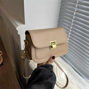 Minimalist khaki leather crossbody square bag with gold buckle and adjustable strap