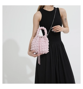 Pink bubble texture bucket bag with drawstring closure and silver chain strap details