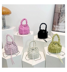 Mini cloud bucket bags in five colors with bubble pleated texture and silver chain straps