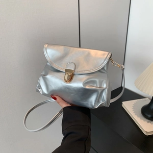 Silver metallic pleated crossbody bag with gold buckle and adjustable strap