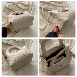 Macro details of beige quilted bow handbag showing base, side, and interior storage space
