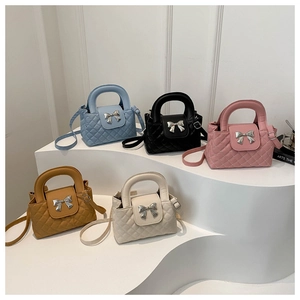 Detailed display of five colorful quilted crossbody bags with decorative bow and top handles