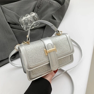 Silver sequin square bag with gold H clasp and top handle for women's crossbody wear