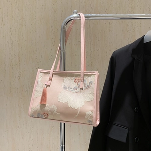 Pink Chinese-style tote bag with exquisite floral embroidery and long silk tassel detail