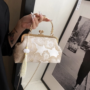 Vintage jacquard handbag with gold floral embroidery, metal handle and tassel charm