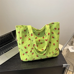 Green corduroy tote bag with red strawberry embroidery for daily casual use