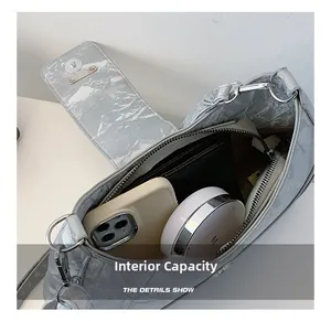 Detail view of the spacious inner compartment and magnetic closure of the marble pattern bag