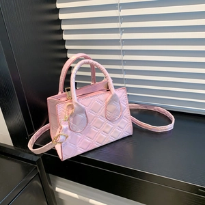 Pink quilted leather mini handbag with gold hardware and adjustable strap for women