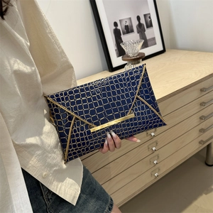Navy blue crocodile pattern envelope clutch with gold metal bar closure for women