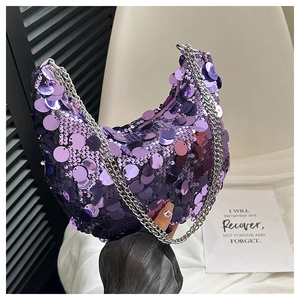 Detail of purple sequin baguette bag featuring silver chain strap for evening party